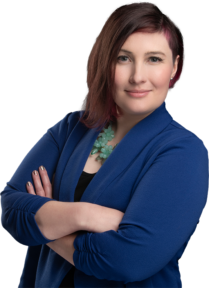 Photo of Tomiyo Stoner in a blue blazer with arms crossed